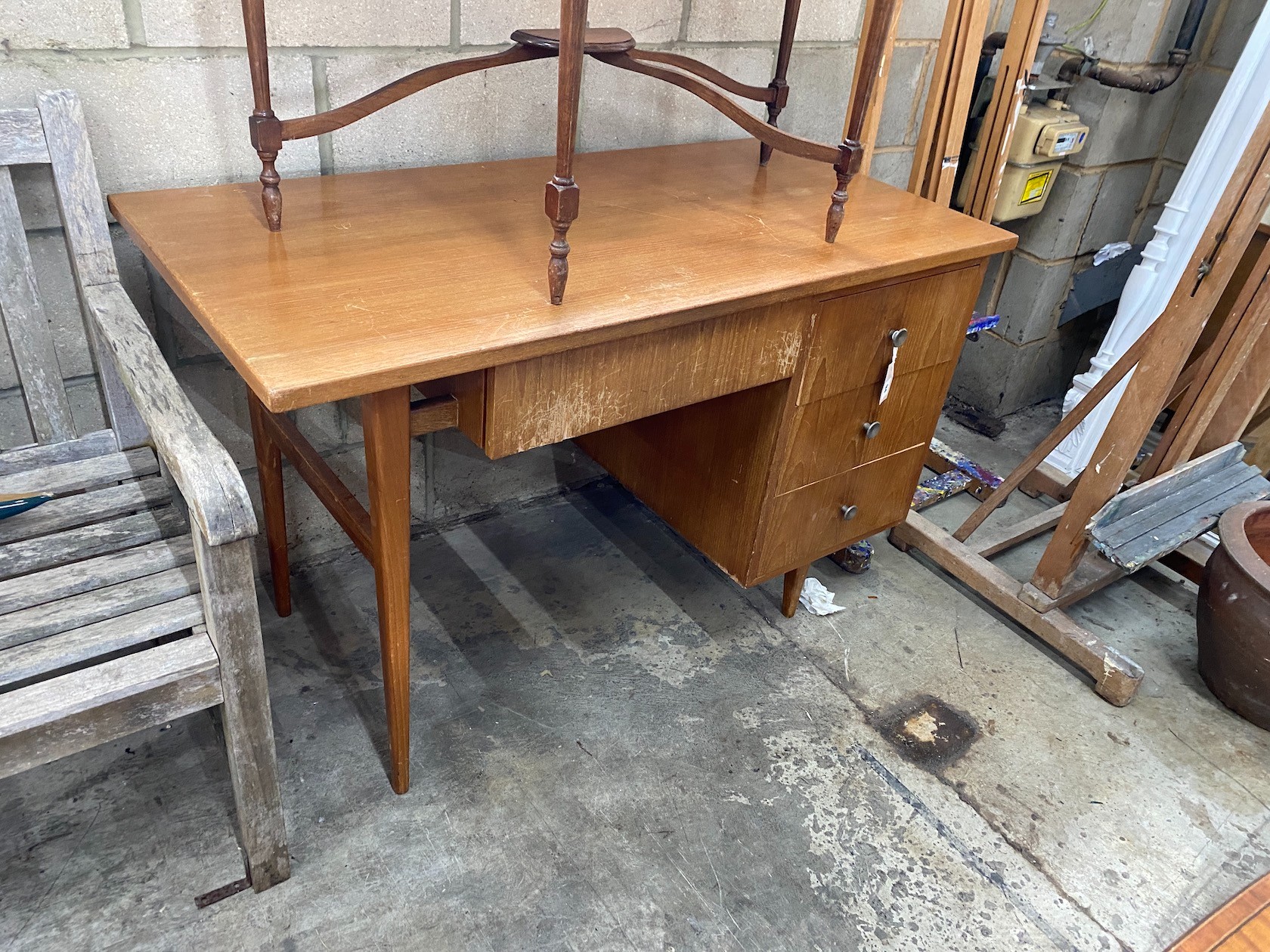 A mid century teak kneehole desk, length 121cm, depth 60cm, height 76cm